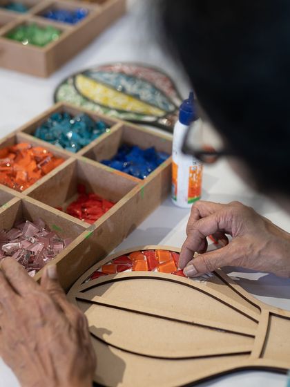 A close-up of our mosaic-making process. The simple act of placing each tile is incredibly therapeutic and relaxing. We have tons of designs to choose from, like this hot air balloon.