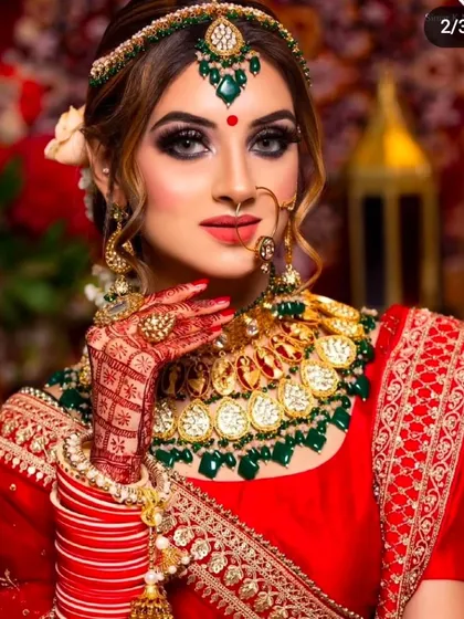 Achieve the timeless red and green bridal look without the investment. This model is styled in one of our classic red lehengas paired with a beautiful Polki and green bead jewellery set, all available for your shoot.