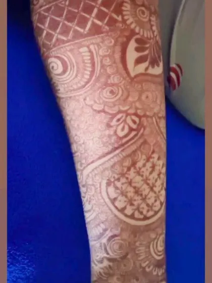 A close-up of the stain on the arm. You can see the fine details are still crisp and clear, and the color is a beautiful, even brown.