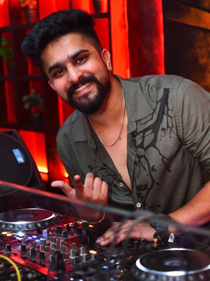 You were born to be real, not perfect. A candid moment behind the decks.