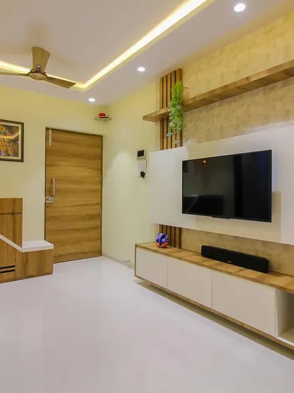 Another perspective of this living room, showing the entryway and the custom shoe cabinet that blends with the overall design.