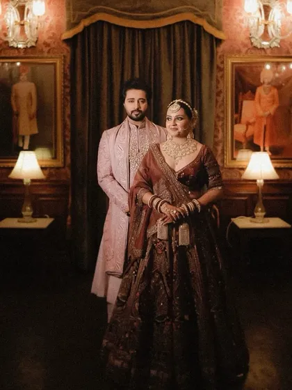 A royal look for a wedding in Jodhpur. I styled the groom in an old rose sherwani with a dull gold zardozi angarkha, creating a look that is both regal and sophisticated, perfectly complementing the bride's ensemble.