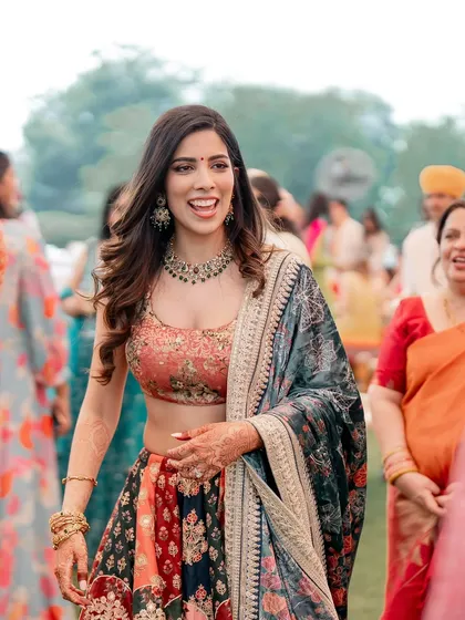Another shot of this stunning Mehendi look. The bride is glowing with happiness, and her makeup is designed to enhance that natural radiance, keeping it fresh and beautiful throughout the day's events.