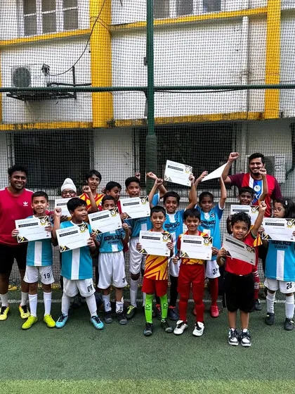 All smiles and certificates after a friendly match. These games are crucial for development and building confidence.