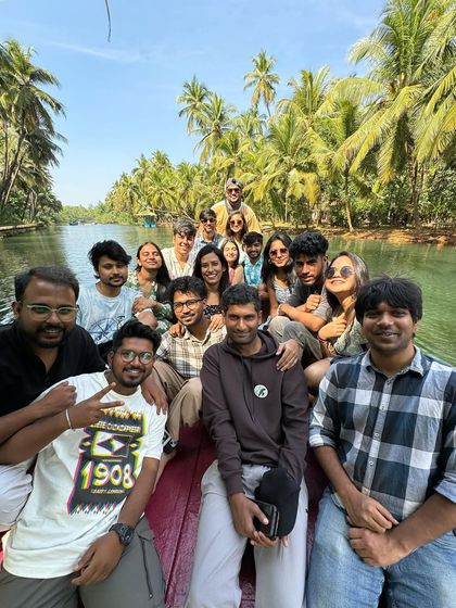 Our group enjoying a leisurely boat ride through the lush green backwaters of Honnavar, a highlight of our Gokarna getaway.