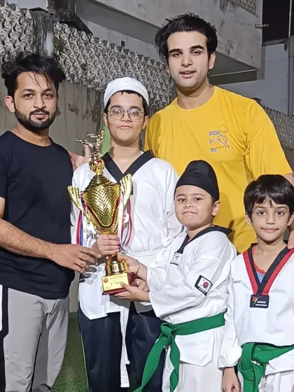 Me and another instructor with some of our top competitors. It's a team effort between students and coaches to achieve this level of success.
