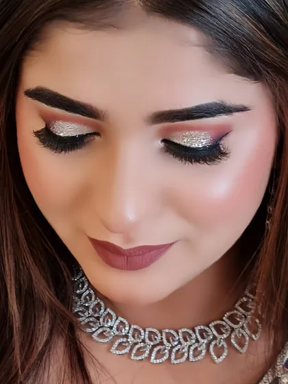 That's called a glass finish look for my Barbie doll. This close-up shows the stunning silver glitter eye makeup and flawless skin.