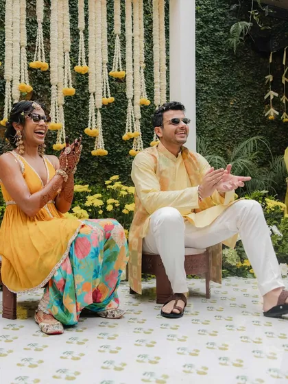 The happy couple sharing a laugh during their Haldi. We made sure their outfits were coordinated in bright, festive colors, reflecting the joyful atmosphere of the event.