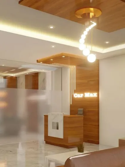 Another perspective of the office waiting area, showing the relationship between the seating area, reception, and the manager's cabin behind the glass wall.