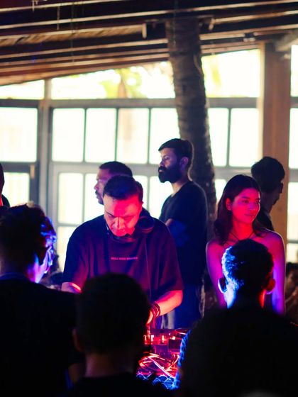 A shot of me at the decks, surrounded by the crowd. The intimate setting of 9 Bar allows for a powerful connection between the DJ and the audience.