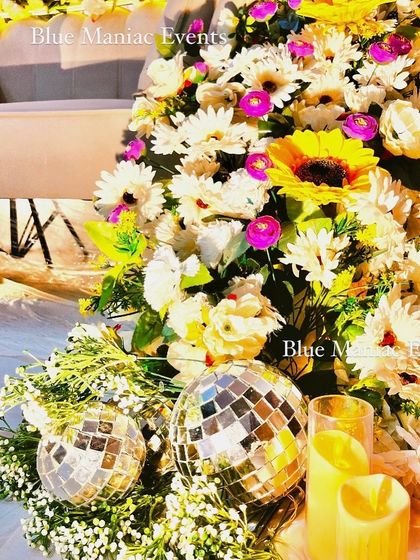 Another detail shot of the floral couch, focusing on the disco balls and candles. This shows how I use unique props to enhance the overall theme and add a bit of sparkle.