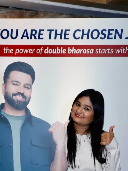 A fun moment next to a cutout of brand ambassador Rohit Sharma at the Axis Max Life event.