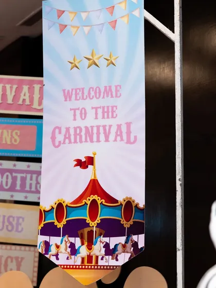 A "Welcome to the Carnival" banner featuring a classic carousel design.