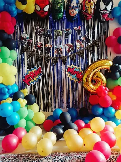For a 6th birthday, I created this action-packed Avengers superhero theme. The setup includes a full balloon arch, character foil balloons of Spiderman and Hulk, and a themed "Happy Birthday" banner against a shimmer curtain.