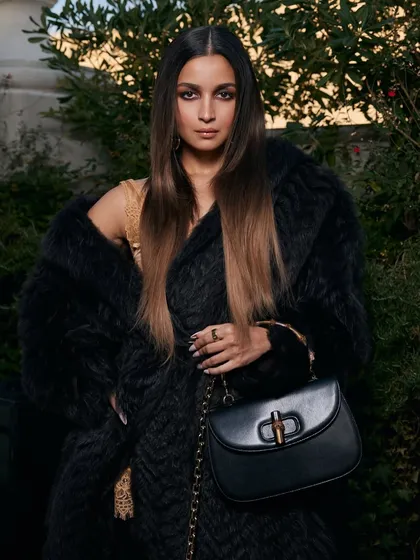 Another angle of Alia Bhatt's chic look for The Tiger premiere. The straight, center-parted hair is modern and powerful, perfectly framing her face and complementing the structured fashion.