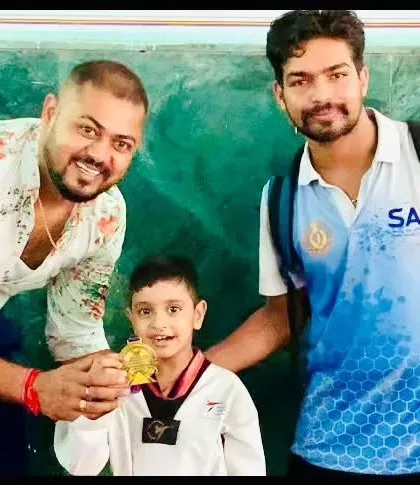 A close-up of a young champion with his gold medal. The joy of achievement is what we strive for.