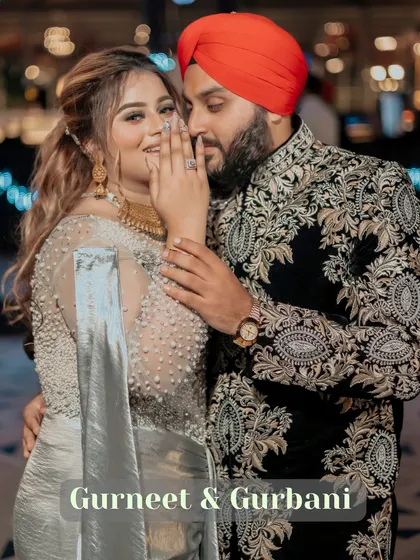 A playful and intimate moment between Gurbani and Gurneet. Her hand gently covering her smile as he whispers to her makes for a perfect candid shot.