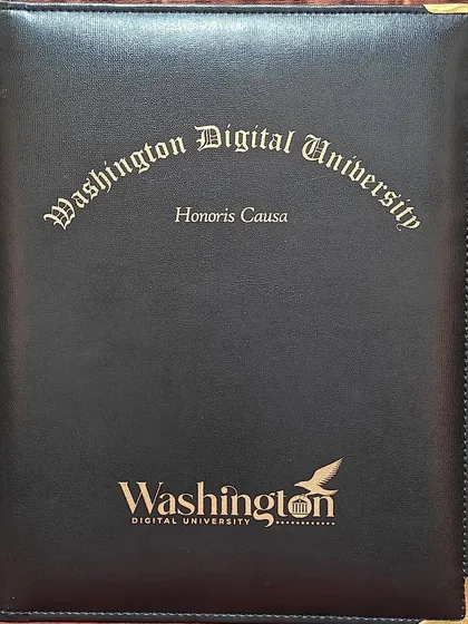 The official folder from Washington Digital University, holding the Honorary Doctorate degree, marks a significant milestone in our institution's journey.