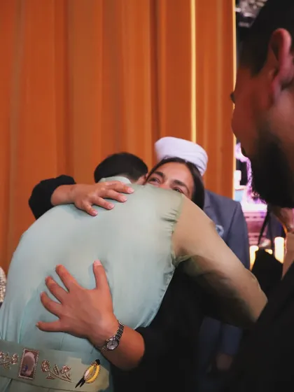A heartfelt hug with a friend or fan after the London show. These moments of human connection are just as important as the music itself.