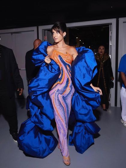 For Nora Fatehi's main IIFA 2023 appearance, we went for high drama with this structural Jean-Pierre Khoury gown. The voluminous royal blue wrap over a psychedelic-print catsuit was a bold fashion choice that truly owned the carpet.