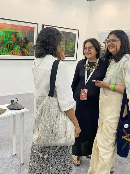 Guests chatting at our booth during the Art Mumbai fair.