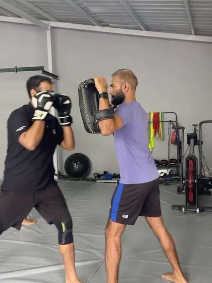 Focus and determination during a boxing drill.