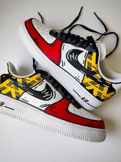 A top-down view of the Arsenal "Bruised Banana" custom AF1s. The famous retro pattern is on the side panels, contrasted with the red toe box.