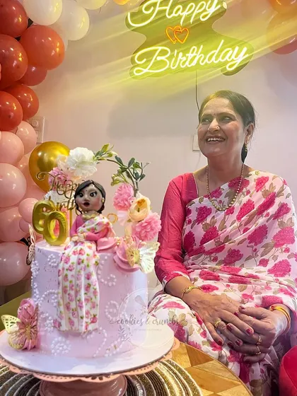 It's the best feeling to see my cake become a part of such a happy moment. I created this custom miniature doll cake for a 60th birthday, matching the fondant figure's saree to the birthday girl's actual outfit.