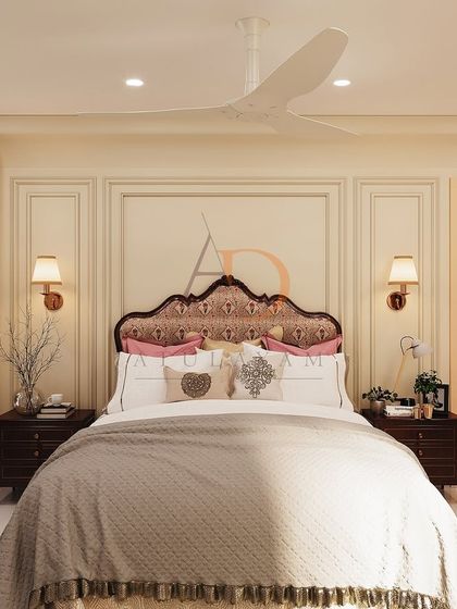 A frontal view of the classic bedroom, highlighting the symmetrical arrangement of bedside tables and wall sconces against a paneled wall.