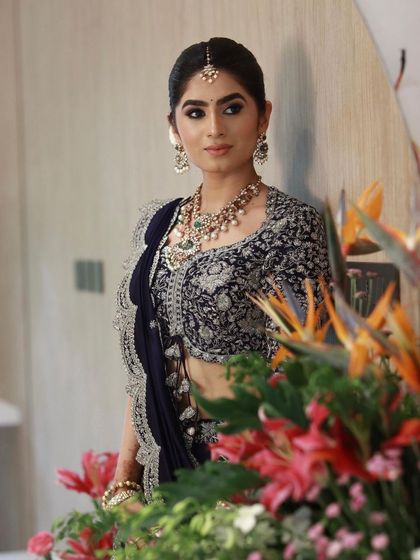 A beautiful shot with floral decor, adding to the elegance of this reception-style look.