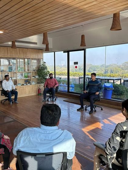 An interactive Q&A during a corporate workshop. I believe in creating a space where employees can openly ask questions about their physical and mental health challenges, allowing me to tailor the practices to their specific needs.