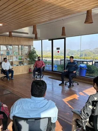 An interactive Q&A during a corporate workshop. I believe in creating a space where employees can openly ask questions about their physical and mental health challenges, allowing me to tailor the practices to their specific needs.