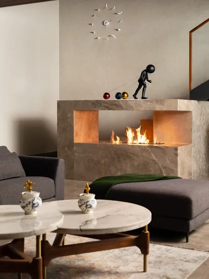 A close-up of the bio-ethanol fireplace, a modern and eco-friendly feature that adds warmth and ambiance without the need for a chimney. It's a perfect example of how we integrate contemporary technology into our designs.