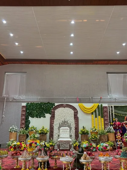 A wide view of the entire ceremony area with the Golu display on the side.