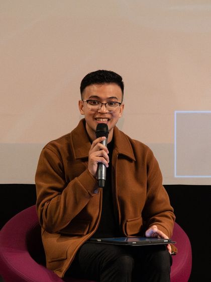 A smiling participant after his performance. Our workshops are not just about learning; they are about building confidence and finding joy in art.