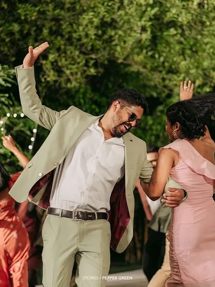 The couple, Ameera and Richard, dancing with their friends at the reception. I capture the energy and fun of the party to show the celebratory side of your wedding.