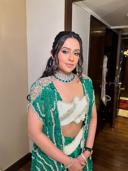 Another view of the client's unique and stylish look, perfect for a fashion-forward wedding guest.