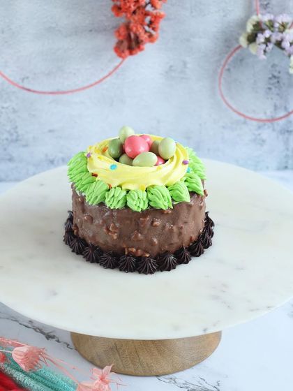 A nutty chocolate Easter cake with a cute nest of mini eggs on top. A delightful combination of textures and flavours.