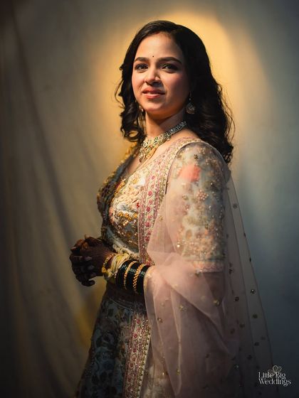 A stunning portrait of a Maharashtrian bride, her natural beauty enhanced by the soft lighting.
