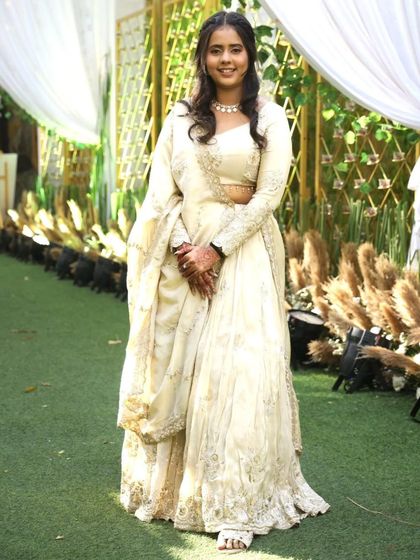 She's glowing like a dream! A picture-perfect moment with our client Jiya in her handcrafted lehenga. Her smile makes the outfit shine even brighter.