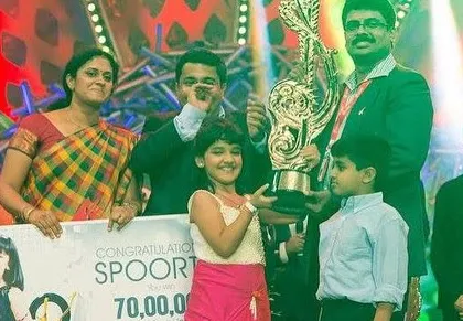 This picture takes me back. Winning Super Singer Junior 4 was a life-changing experience that started my journey in music. Holding that trophy with my family by my side is a core memory that still fuels my passion today.