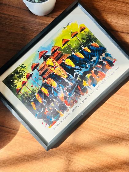 Another look at the 'Thrissur Pooram' print in a black frame, this time catching the morning light. The colors really pop, bringing the energy of the festival to life.