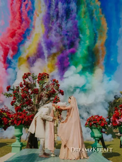A Varmala moment that erupts in a cloud of vibrant color. This image captures the pure, unscripted joy that I aim to create, punctuating a sacred tradition with a burst of modern, celebratory energy.