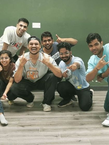 A happy group of dancers after a challenging but rewarding class. The smiles say it all. We're a community that supports each other's growth.