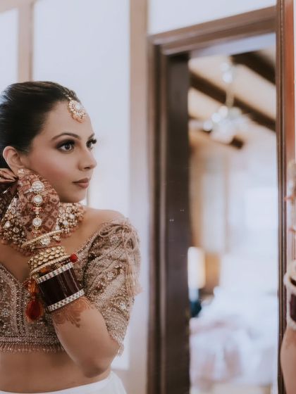 A beautiful destination wedding look. The bride is getting ready, and her soft, elegant makeup is already looking perfect.