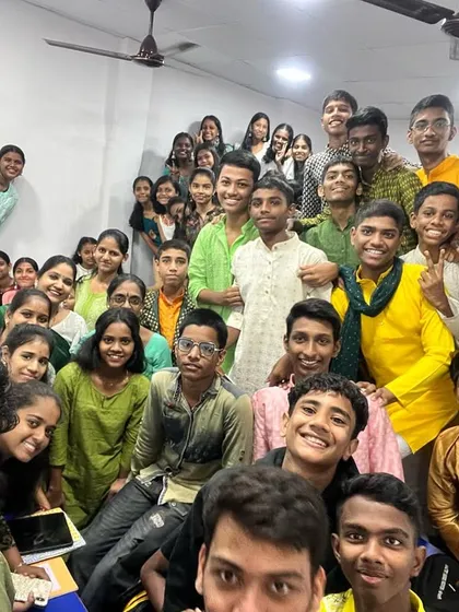 A vibrant group photo of students celebrating the green day of Navratri 2023, symbolizing new beginnings.