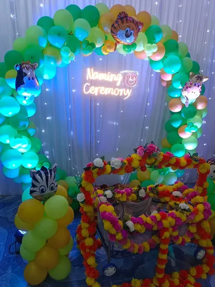 Another angle of the jungle-themed naming ceremony balloon arch.
