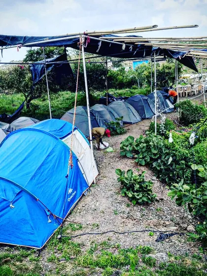 A look at our campsite arrangement during the day. We provide rows of comfortable tents, ensuring everyone has a place to rest after a full day and night of activities.