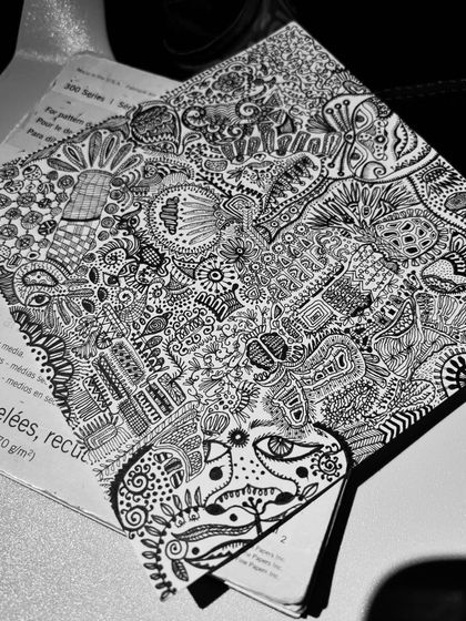 The artwork from a different angle, revealing more hidden details and flowing lines.