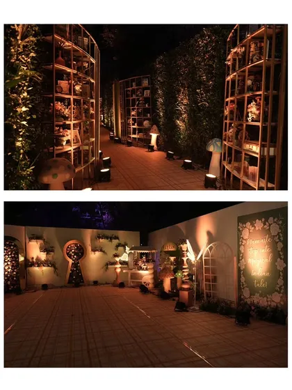 A pathway lined with curiosities. The entrance to this Mehndi featured shelves filled with books, flowers, and whimsical objects, creating a sense of discovery and wonder for arriving guests.